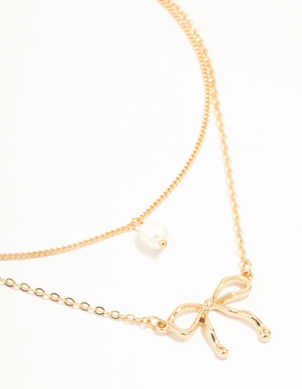 Gold Pearl & Bow Layered Necklace For Sale
